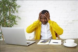72256b70-e747-4d44-924c-ff0432778824-frustrated-dark-skinned-businessman-sitting-workplace-with-hands-head-feeling-stressed-looking-laptop-screen-panic-unable-keep-company-afloat-having-enough-money-run-business.jpg